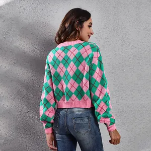 Detailed back view of a pink and green argyle pattern jacquard knit cropped cardigan