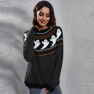 Woman wearing a black knitted sweater with white ghost patterns for a festive Halloween style