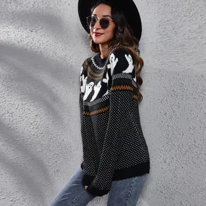 Close-up detailed view of Halloween ghost knitted sweater with retro polka dot pattern