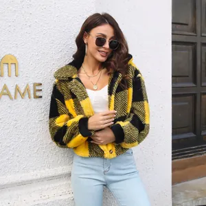 Model wearing a yellow and black plaid fuzzy crop jacket with a textured finish.