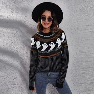 Detailed view of Halloween ghost pattern and retro polka dot knit on black women's sweater