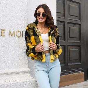 Yellow and black plaid fleece jacket for women worn by a model in an urban setting