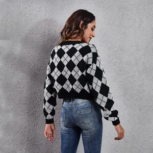Back view of cropped argyle jacquard knit sweater in black and white pattern