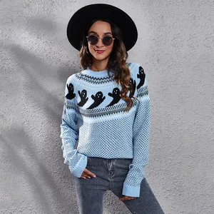 Detailed close-up of the vintage black ghost knit pattern on a light blue sweater