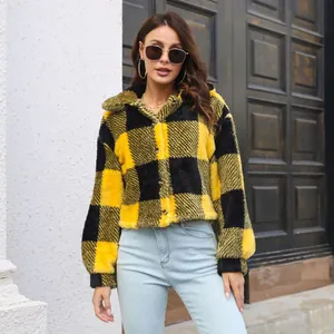 Close-up of yellow and black checkered fleece jacket featuring trendy balloon sleeves