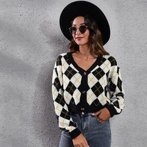 Detail shot of the black and white argyle pattern on this stylish cropped knit cardigan