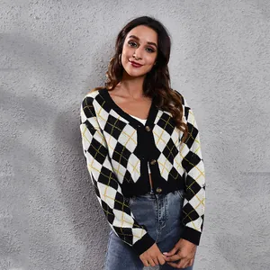 Detailed view of women's argyle knit cropped cardigan featuring V-neck and buttons