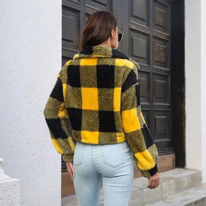 Back view of a cozy yellow and black plaid fleece jacket featuring lantern sleeves and short length