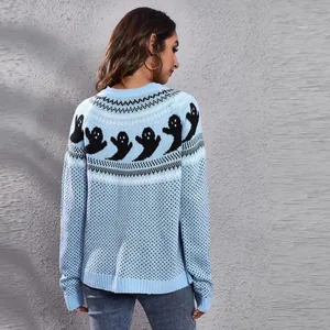 Detail view showing the back of a light blue knitted sweater with black ghost pattern