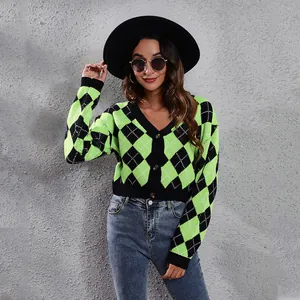 Detailed view of neon green and black argyle pattern on a short knit cardigan