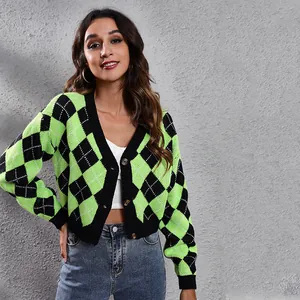 Front view of a model wearing a green and black argyle cropped knit cardigan with V-neck