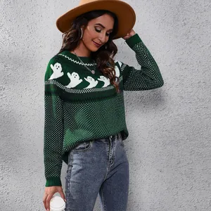 Detailed lifestyle view of women's vintage green knit sweater with Halloween ghost patterns.