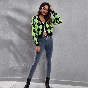 Detail view of women's cropped argyle jacquard knit cardigan in green and black