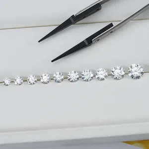 Detailed view of graduated sizes of round brilliant cut lab-grown loose diamonds