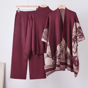Elegant 3-piece knitted set with high-neck sweater, pants, and landscape shawl in burgundy