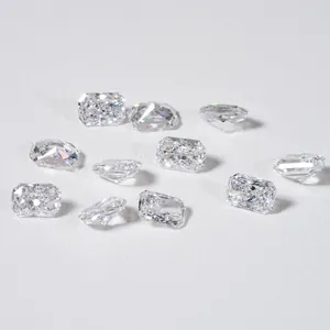 Multiple brilliant radiant cut lab-grown diamonds scattered on a clean white background surface