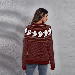 Back view of maroon Halloween sweater with knit ghost patterns and vintage polka dots.