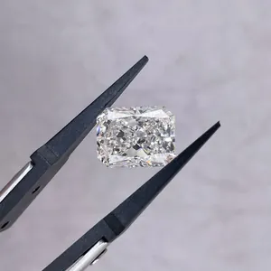 Radiant cut lab-grown diamond held by professional black tweezers for jewelry display