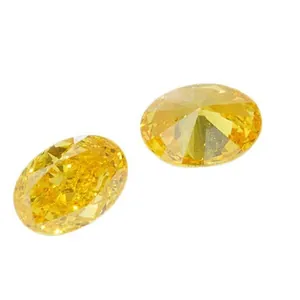 Deux diamants de laboratoire jaune intense taille ovale sur fond blanc immaculé
