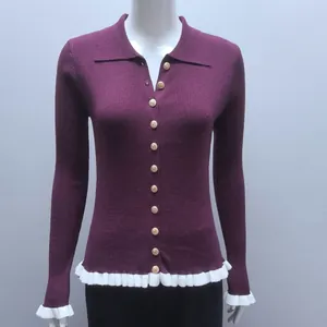 Front detail of a slim-fit plum ribbed knit cardigan with ruffle hem and gold buttons