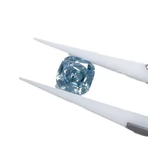 Cushion cut lab-grown blue diamond CVD loose gemstone held by professional white tweezers
