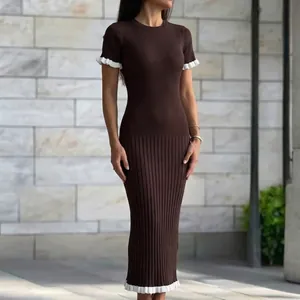 Full view of brown ribbed knit maxi dress featuring contrast white ruffle hem and sleeves.