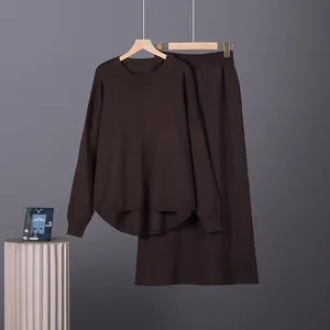 Minimalist dark brown knit set with long sleeve sweater and matching long skirt.