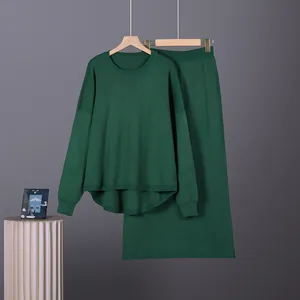 Detailed view of women's dark green two-piece knit set featuring oversized sweater and skirt