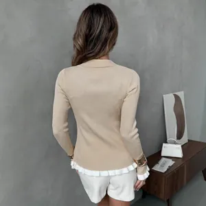 Beige slim fit ribbed knit cardigan with white ruffle hem and lapel collar, back view.