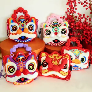 Collection of five colorful plush lion dance crossbody bags in festive indoor setting