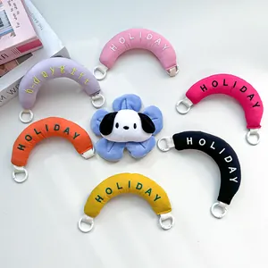 Detailed view of colorful plush arc wrist straps with holiday embroidery and flower charm