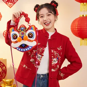 Cute plush lion dance crossbody bag for Chinese New Year, styled with a model.