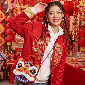 Detailed lifestyle view of a cute plush lion dance crossbody bag in festive Chinese setting