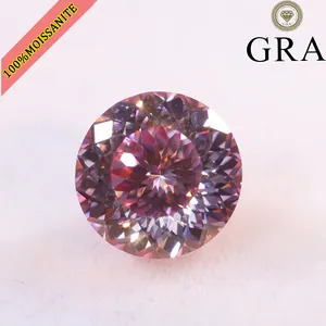 Macro view of a 10ct pink round Portuguese cut moissanite gemstone with fire facets