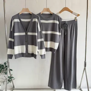 Detailed view of gray and white striped three-piece set with cardigan and wide-leg pants