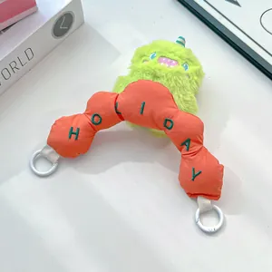 Cute green plush monster bag strap with orange Holiday embroidered handle