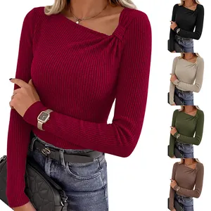 Detail view of slim fit ribbed knit long sleeve shirt with unique asymmetrical knotted neckline