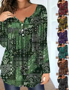 Close-up of women's paisley long sleeve top with button V-neck detail and color variants