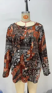 Bohemian paisley print long sleeve blouse with buttoned V-neck and loose fit design