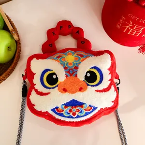 Detailed view of the vibrant lion dance plush crossbody bag with festive red embroidery