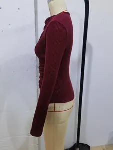 Side view of burgundy ribbed knit top featuring cowl neck and elegant side ruching