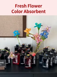Macro view of various flower color absorbent bottles showing vibrant dyed lilies in a vase