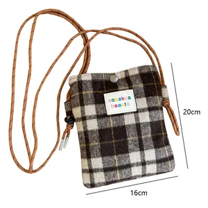 Detailed view of winter plaid wool crossbody bag showing product dimensions 16cm x 20cm