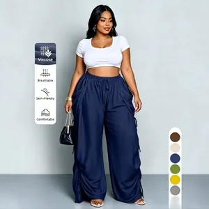 Vista dettagliata dei pantaloni larghi blu navy a vita alta con icone delle proprietà