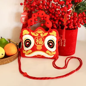 Plush lion dance head shoulder bag with festive red embroidery and a cute character design.
