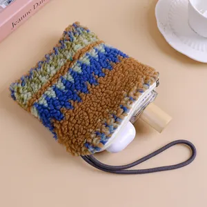 Colorful plush lamb wool pouch for women with casual winter chic design and cord handle.