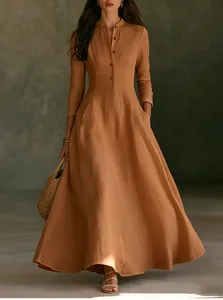 Detailed view of a French retro burnt orange linen maxi dress with stand collar.