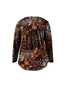 Back view of women's long sleeve top with brown paisley patchwork print and pleats