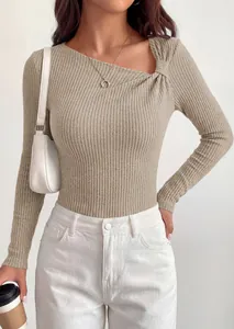 Detail view of women's khaki ribbed knit top featuring asymmetrical knot neckline