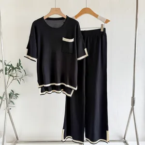Chic women's two-piece knit lounge set with black and white contrast trim details.